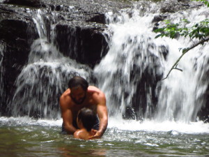 playing in a swimming hole